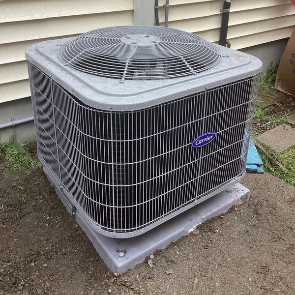 AC unit installed outside house.