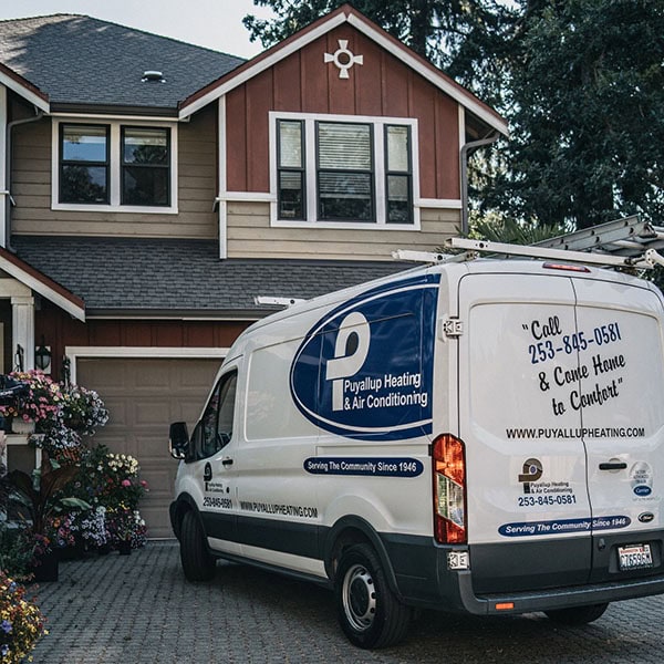 Holiday Safety Tips in Puyallup. Photo of a Puyallup van parked outside of a home to do maintenance