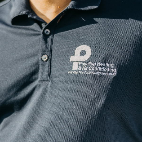 Puyallup HVAC technician’s branded work shirt.