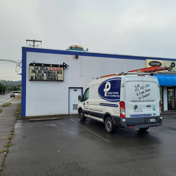 Puyallup HVAC branded truck outside of commercial job site.
