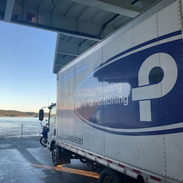 Puyallup HVAC branded truck looking at sunrise.