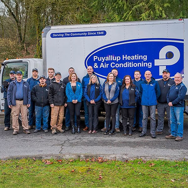 Fall and Winter Care for Commercial Rooftop Units. The team of technicians in front of the company truck.
