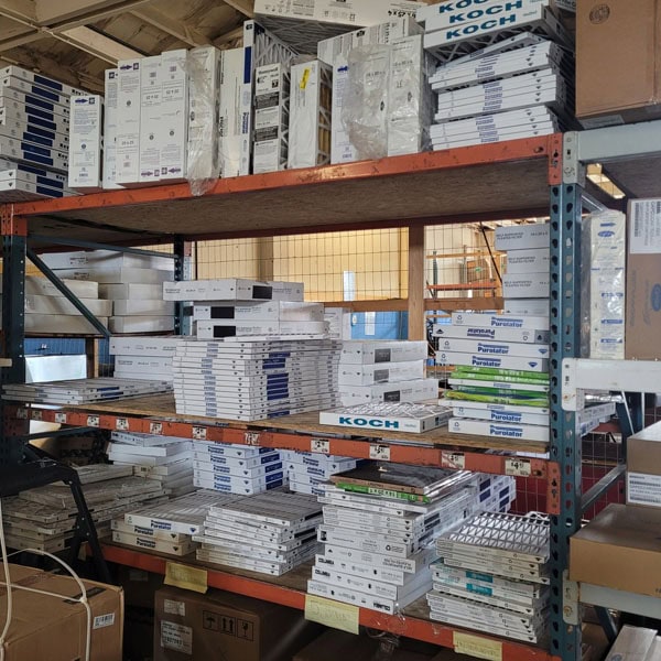 Warehouse shelves filled up with new air filters, ready for install.