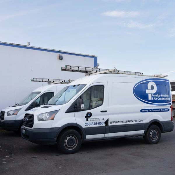 light-switches-and-light-fixtures TOP Puyallup Heating & Air Conditioning branded work truck sitting in parking lot.