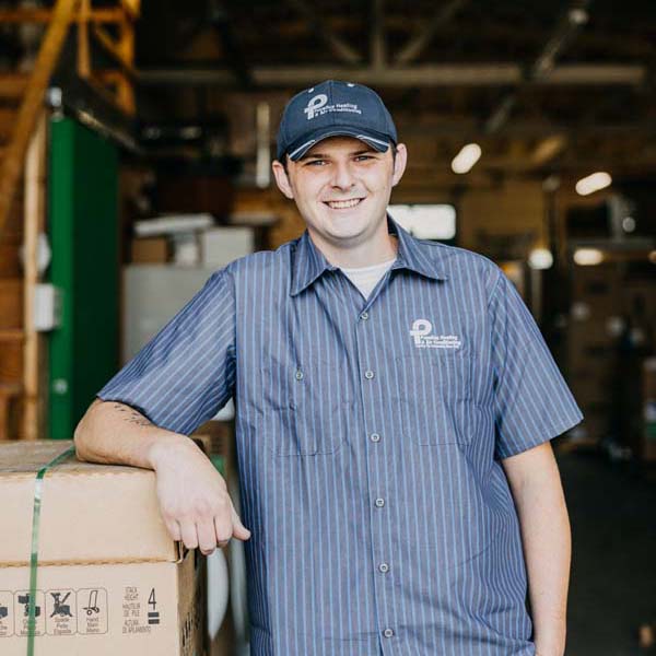 Puyallup HVAC technician wearing company branded work shirt.