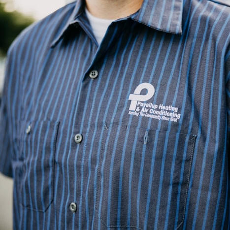 Puyallup HVAC technician’s branded work shirt.