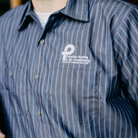 Puyallup HVAC technician’s branded work shirt.